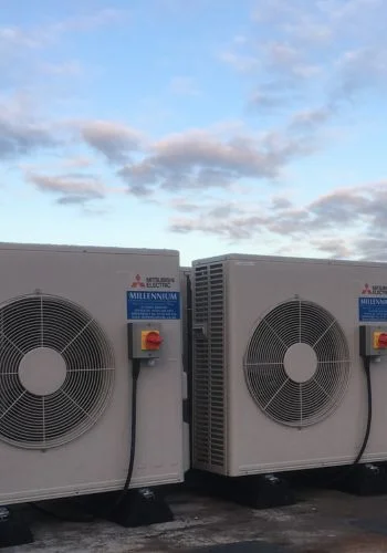 Mitsubishi Electric outdoor units on the roof of the electronics factory, with Millennium labels
